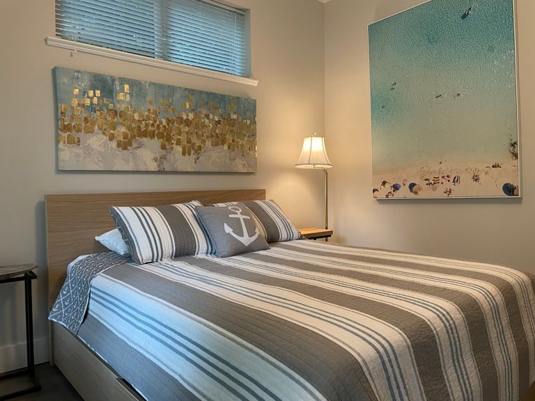 Blue room bed and art work and layout